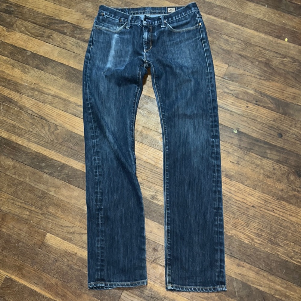 ABSOLUTELY FABULOUS Gold sign blue jeans.